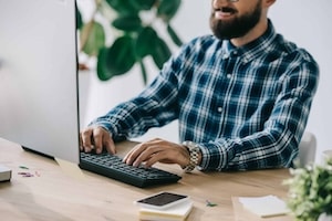 cropped shot of successful seo using computer at workplace