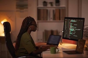 African-American Woman Writing Computer Code