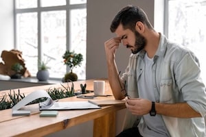 Male businessman concentrates on documents in office