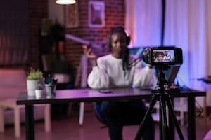 Enthusiastic coach recording podcast to share coaching methods and advice