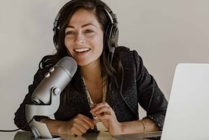 Female radio host broadcasting live in a studio