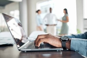 Business professional updating website content and performing backend maintenance tasks