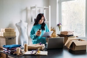 Small business owner managing orders and checkout flow
