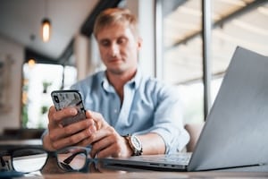 Entrepreneur checking email marketing performance and campaign metrics