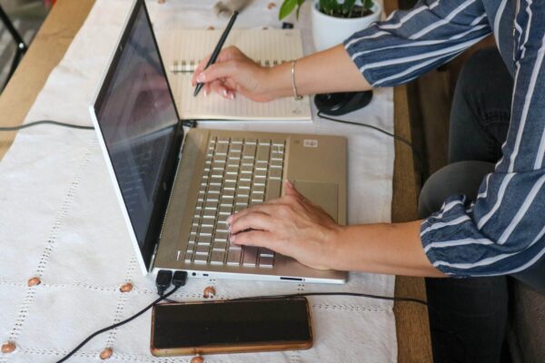 Coach writing an educational blog to share expertise and improve SEO