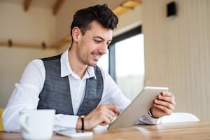 Young man with coffee sitting