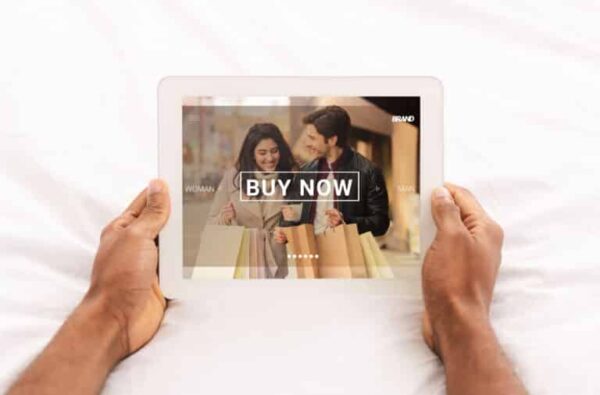 Shopper viewing CTA button on e-commerce site via tablet