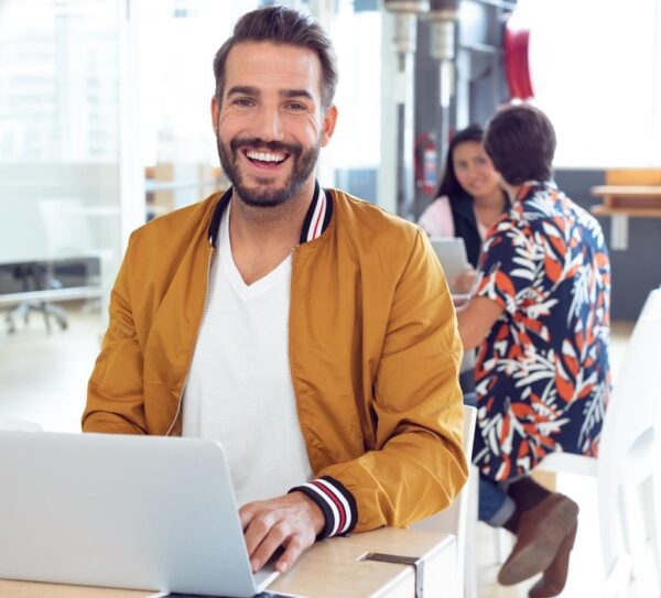 website maintenance team member working on laptop