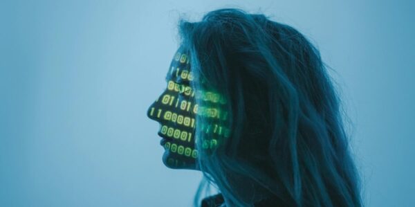 woman with computer code projected onto face