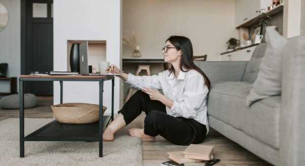 consultant sitting on floor and working on laptop