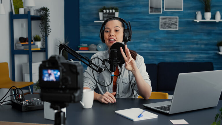 Content creator recording a podcast for repurposing into social media and blog posts