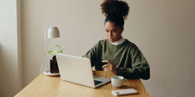 Businesswoman reviewing and improving website reputation online