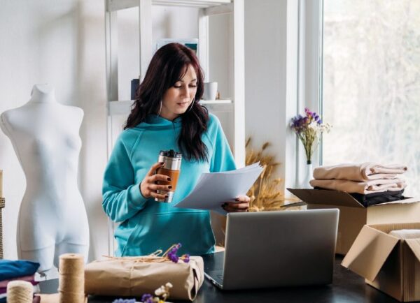 Fashion business owner reviewing online sales and customer journey