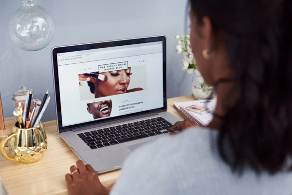 Entrepreneur working on her homepage design, aligning visuals and messaging for brand credibility.
