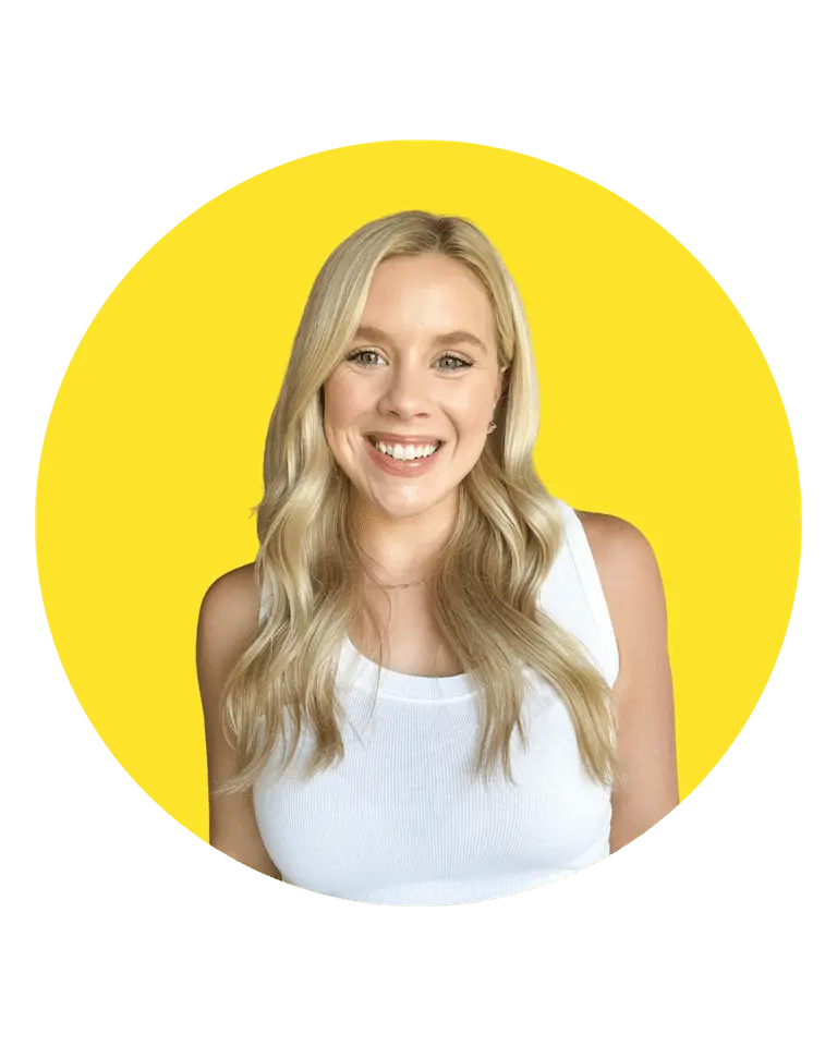 Savannah Abney smiling in white tank top with yellow background