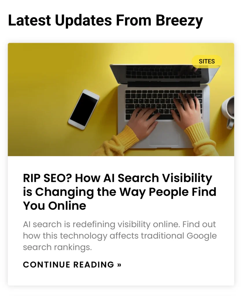 User working on laptop next to phone and coffee, writing content