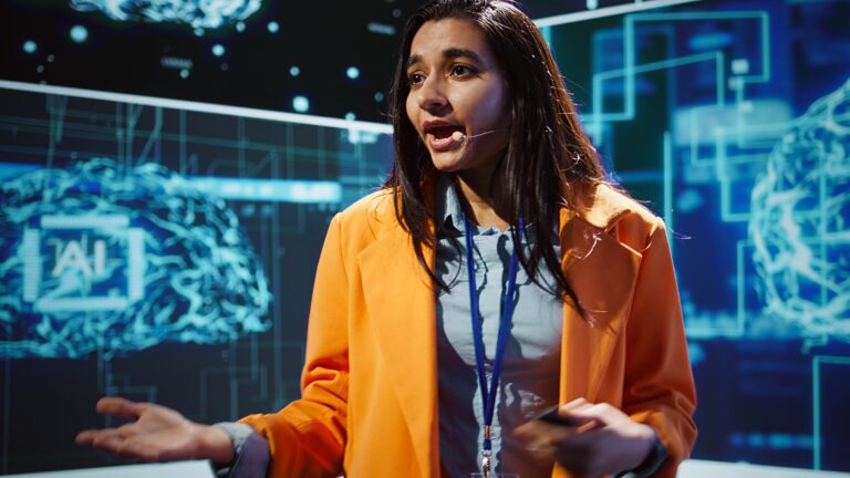 Industry expert presenting AI search insights on stage—illustrating external authority and trust