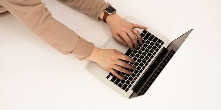 Small business owner updating website for holiday shopping season in October