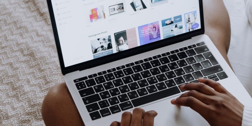 Person working on a laptop reviewing website pages to improve internal linking structure