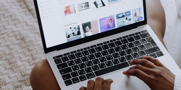Person working on a laptop reviewing website pages to improve internal linking structure