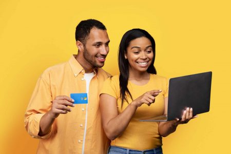 Emotional connection and trust through social proof Happy couple reviewing online purchase after seeing social proof