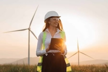 woman-in-helmet-working-with-tablet-at-renewable-energy